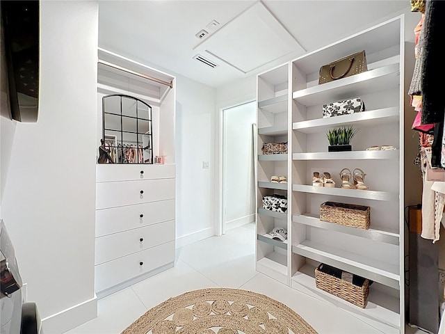 walk in closet featuring visible vents and light tile patterned floors