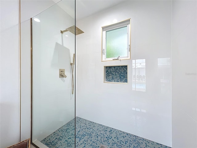 full bathroom with a tile shower