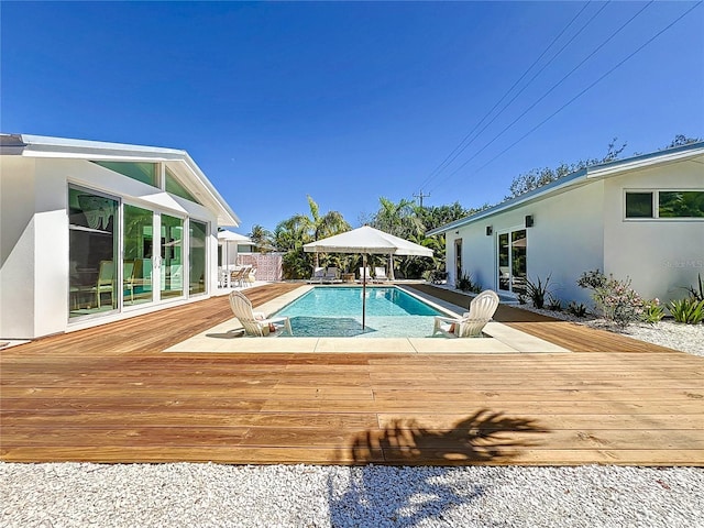 outdoor pool featuring a deck and a gazebo