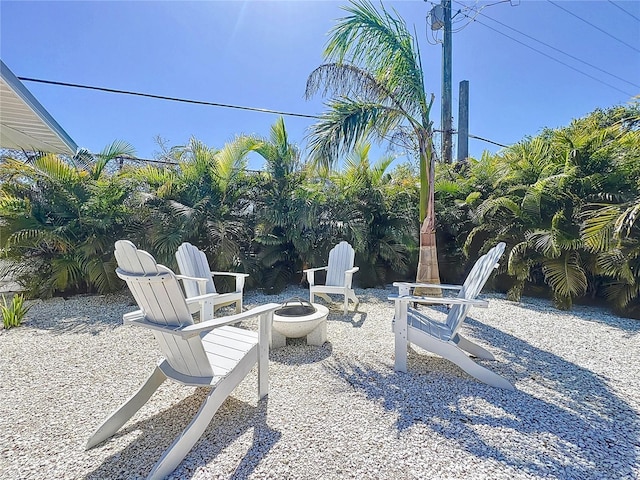 view of patio / terrace with an outdoor fire pit