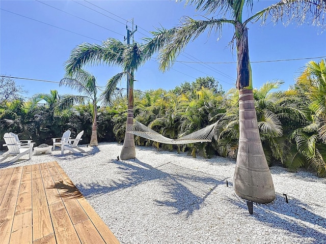 view of community with an outdoor fire pit