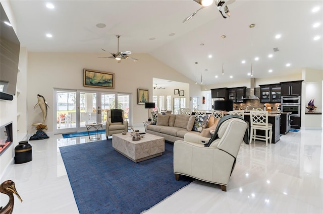 living room with visible vents, ceiling fan, recessed lighting, a fireplace, and high vaulted ceiling