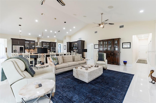 tiled living area with visible vents, recessed lighting, high vaulted ceiling, and ceiling fan