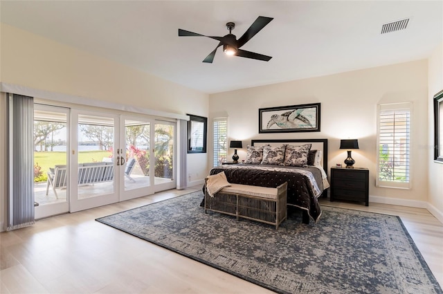 bedroom featuring visible vents, baseboards, french doors, a ceiling fan, and access to outside