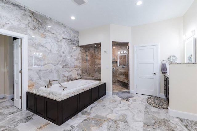 full bath featuring visible vents, walk in shower, a bath, marble finish floor, and tile walls