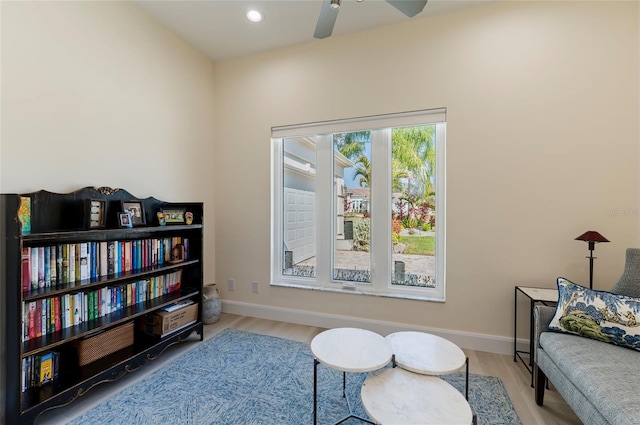 living area with recessed lighting, baseboards, wood finished floors, and a ceiling fan