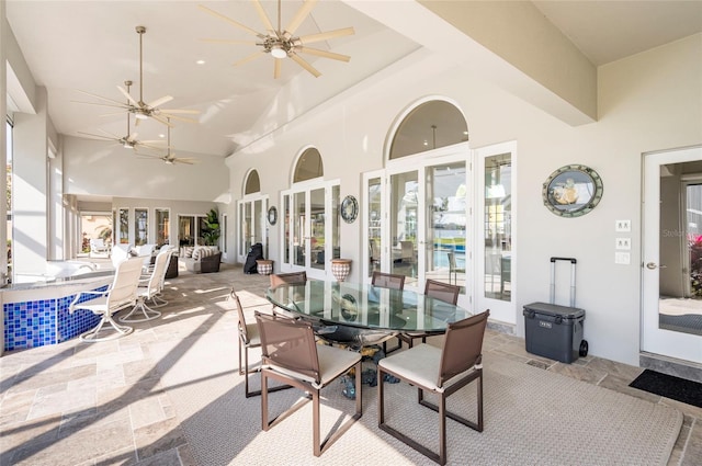 view of patio / terrace featuring french doors, outdoor dining area, and a ceiling fan