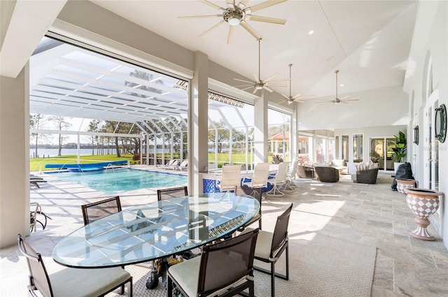 view of patio / terrace with a lanai, outdoor lounge area, an outdoor pool, outdoor dining area, and ceiling fan