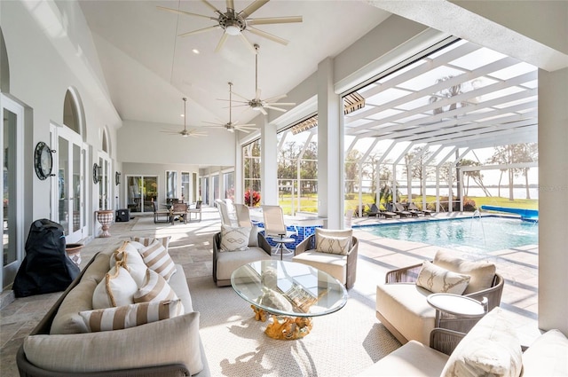 exterior space with a swimming pool, lofted ceiling, and a ceiling fan