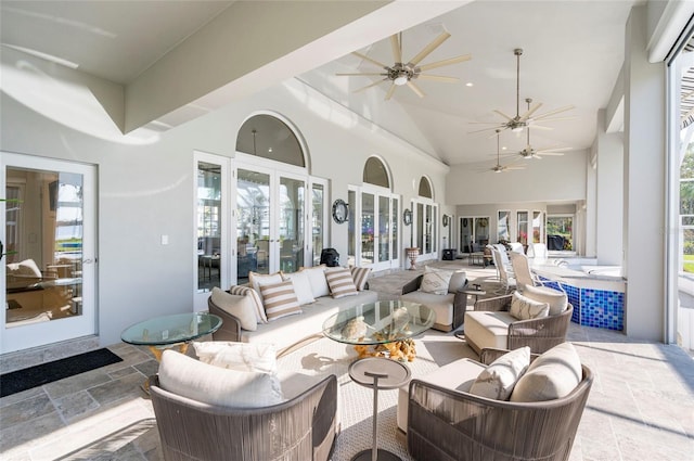 view of patio / terrace with an outdoor living space, french doors, and ceiling fan