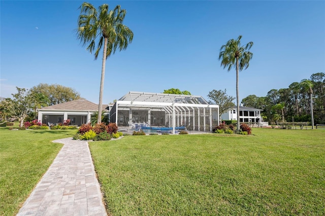 view of yard featuring glass enclosure