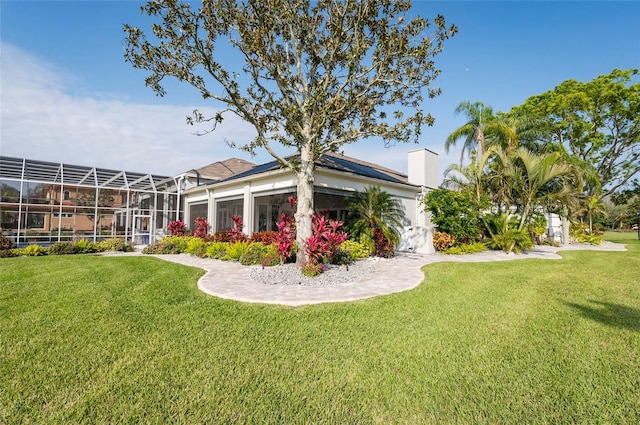 view of yard with a lanai