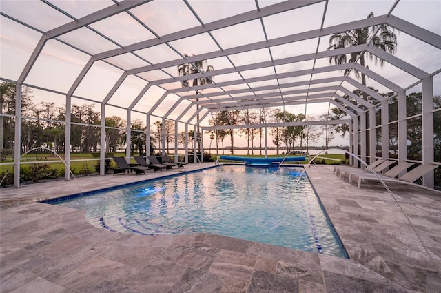 pool with a lanai and a patio