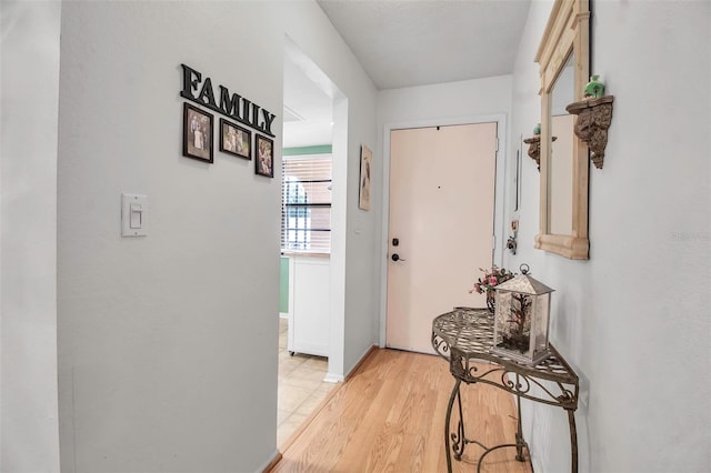 hallway with light wood-style floors