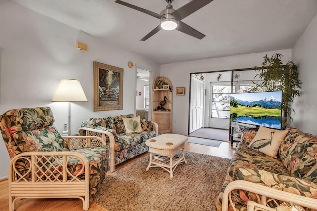 living room featuring ceiling fan and wood finished floors