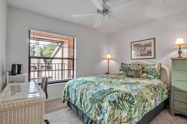 carpeted bedroom with a ceiling fan