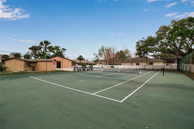 view of sport court with fence