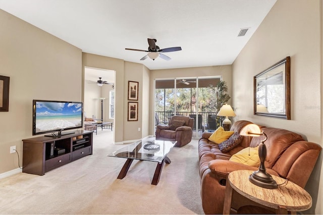 living room with light carpet, visible vents, ceiling fan, and baseboards