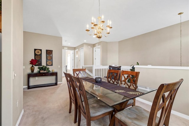 dining area with recessed lighting, baseboards, light carpet, and a notable chandelier