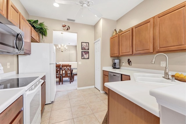 kitchen with light tile patterned floors, visible vents, a sink, light countertops, and appliances with stainless steel finishes