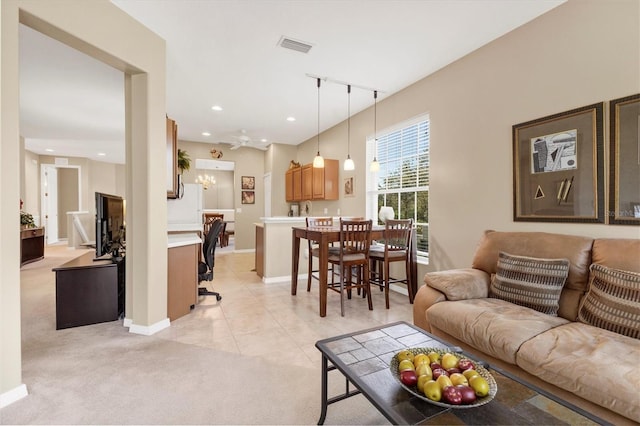 living room featuring visible vents, baseboards, light colored carpet, light tile patterned floors, and recessed lighting