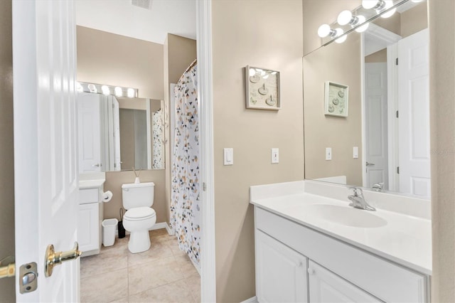 bathroom with visible vents, a shower with curtain, toilet, tile patterned flooring, and vanity