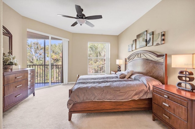 bedroom featuring ceiling fan, light carpet, and access to exterior