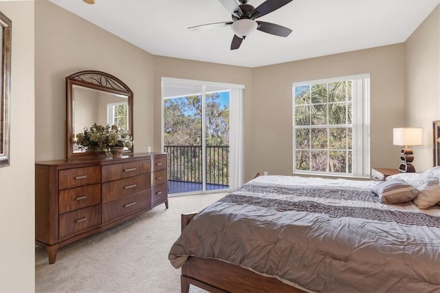 bedroom featuring ceiling fan, access to outside, and light carpet