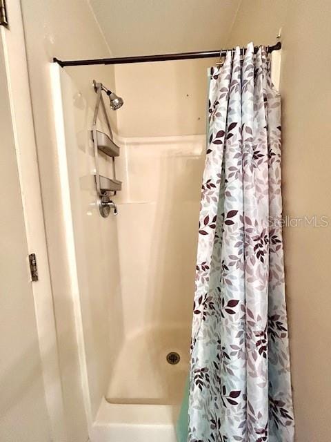 full bath featuring a stall shower