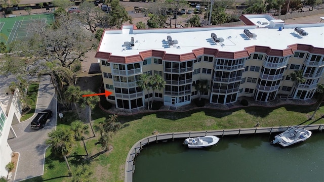 birds eye view of property with a water view