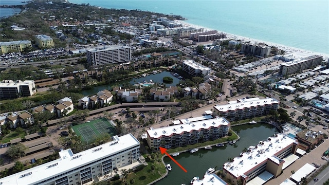 bird's eye view featuring a water view and a view of city