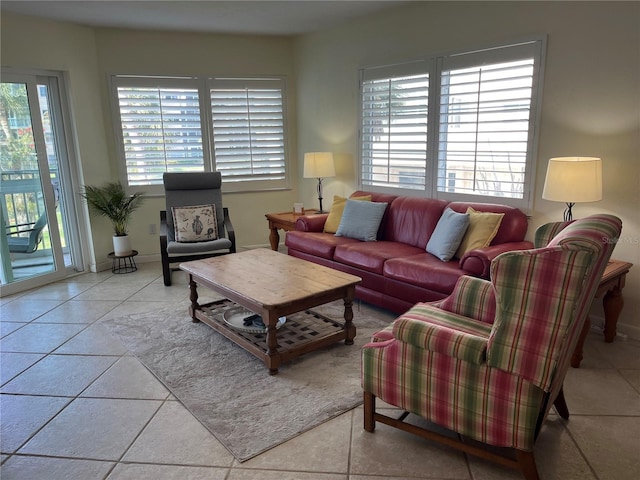 living area with plenty of natural light and light tile patterned floors