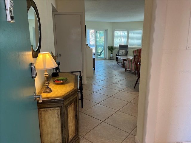 hallway featuring light tile patterned floors