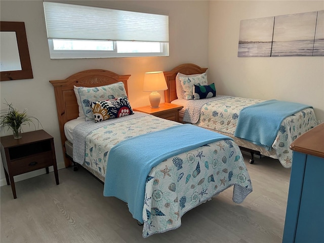 bedroom featuring wood finished floors