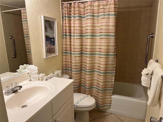 bathroom featuring tile patterned flooring, toilet, a textured wall, shower / bath combination with curtain, and vanity