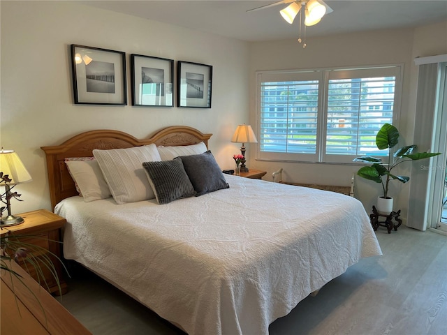 bedroom featuring ceiling fan and wood finished floors