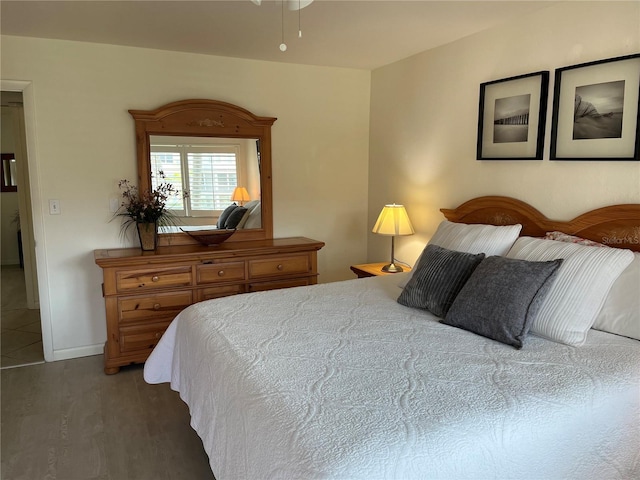 bedroom with wood finished floors