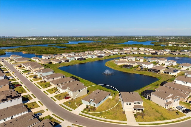 birds eye view of property with a residential view and a water view