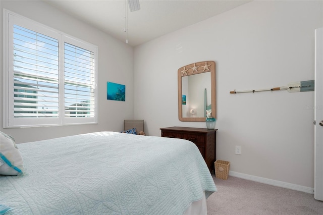 bedroom featuring baseboards and carpet floors