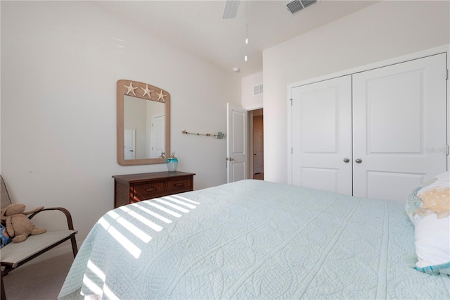 bedroom with a closet, visible vents, and ceiling fan