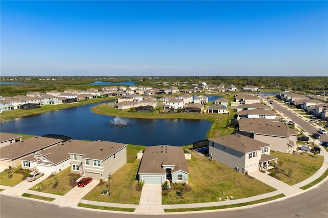 bird's eye view with a residential view and a water view