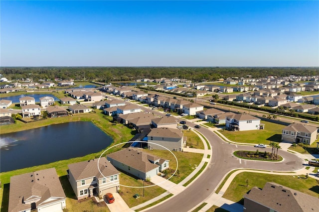 aerial view featuring a residential view and a water view