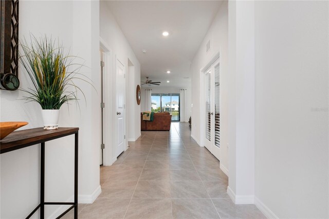 3677 Turning Tides Ter, Bradenton, FL 34208 - corridor featuring recessed lighting, baseboards, and light tile patterned floors