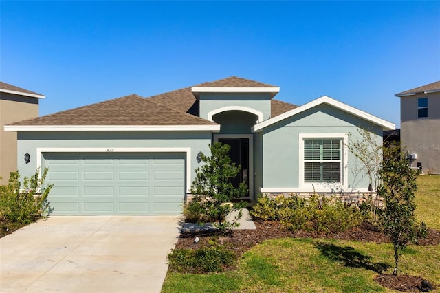 3677 Turning Tides Ter, Bradenton, FL 34208 - single story home featuring a garage, stucco siding, driveway, and a shingled roof