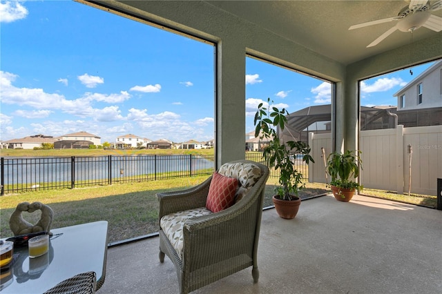 3677 Turning Tides Ter, Bradenton, FL 34208 - sunroom / solarium with a water view, a residential view, and ceiling fan
