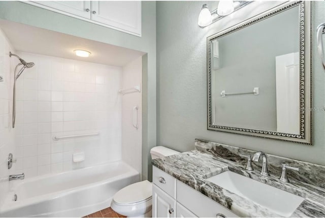 bathroom featuring shower / bath combination, toilet, vanity, and a textured wall