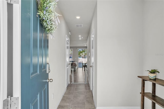 entryway with light tile patterned floors, recessed lighting, and visible vents