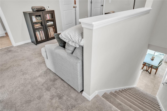 interior space featuring baseboards and carpet