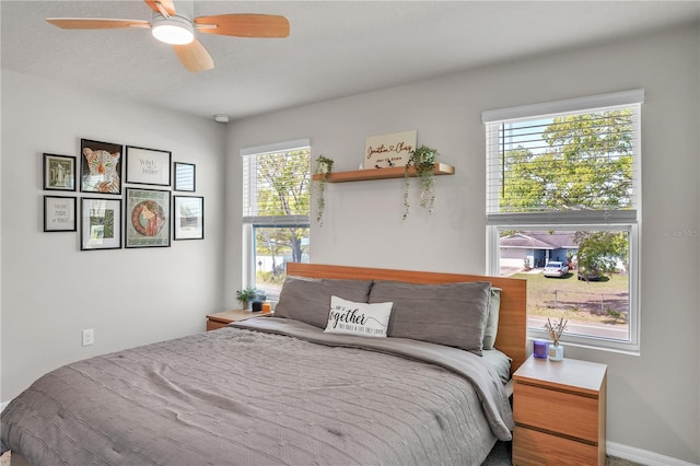 bedroom featuring baseboards and a ceiling fan