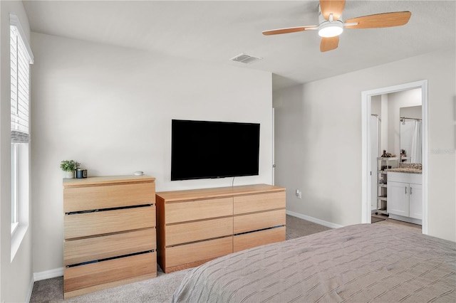 bedroom with visible vents, baseboards, and carpet